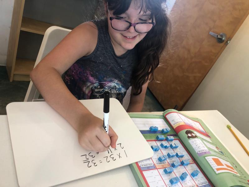 New personal sized whiteboards help the Ocean Studies Charter School students complete their work.